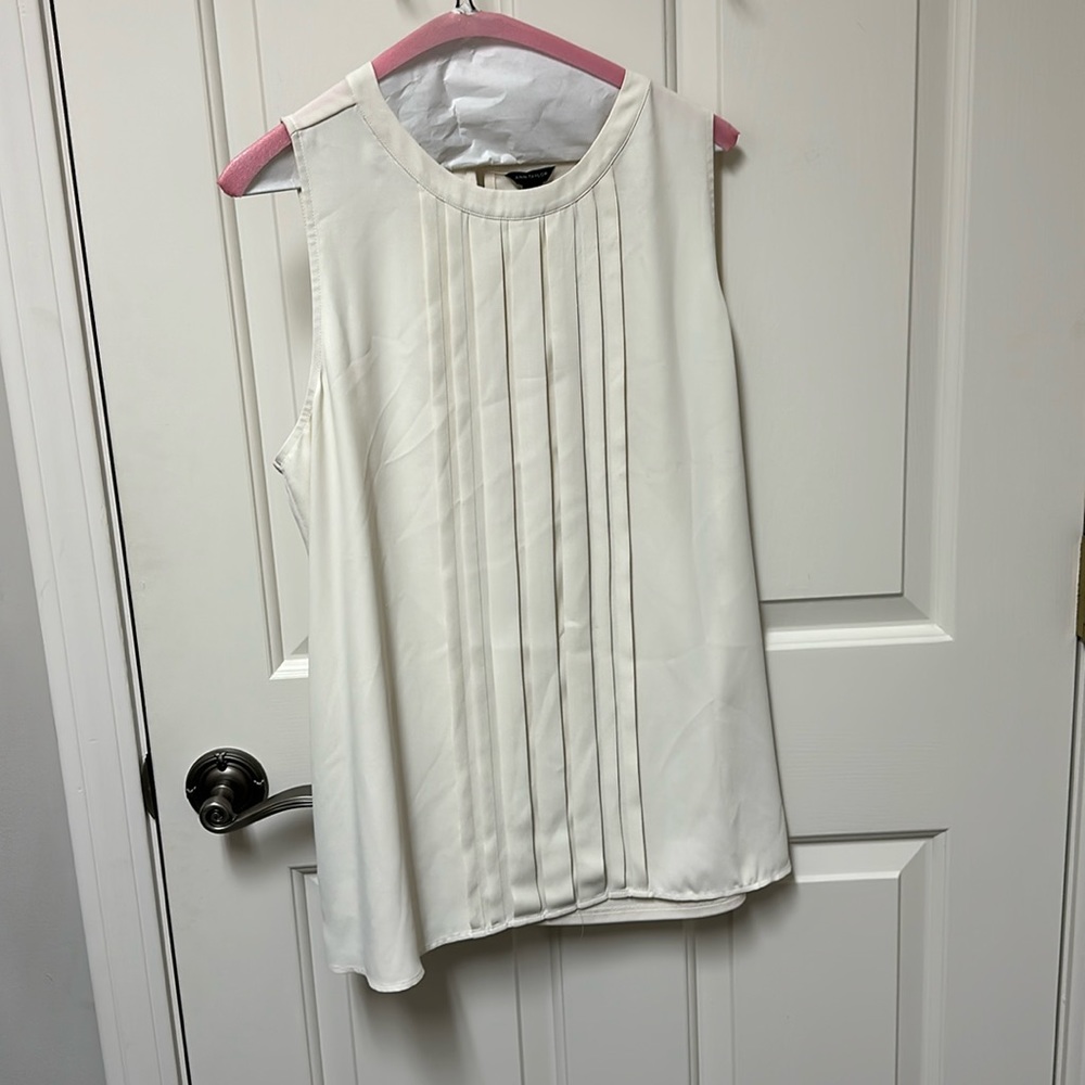 Brand: Ann Taylor off white sleeveless blouse. Size: Large.